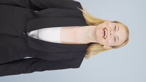 Vertical-video-of-Business-woman-laughing-at-camera.